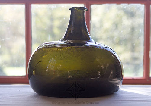 Black Glass Onion Wine Bottle, Similar in form and construction to AG pg. 73, right